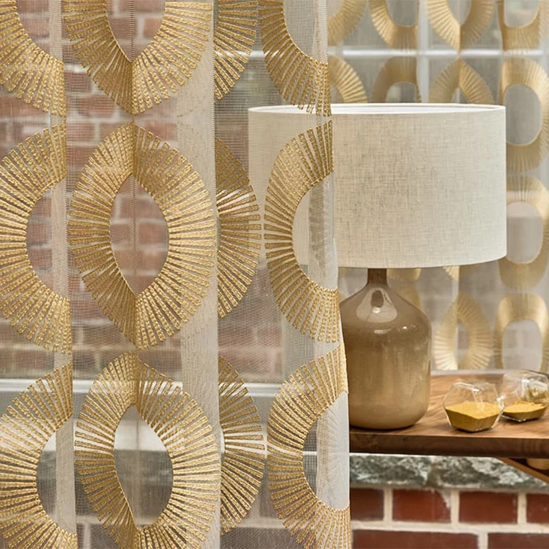 Aura – moderne transparente Gardine nach Maß mit edler Art-Déco Kreisstickerei, gold silber